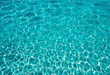 © Giuseppe Cammino - Beautiful turquoise blue ocean water surface with light reflections and highlights. Texture of water close-up macro