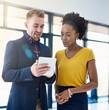 © peopleimages.com - Businessman, woman and tablet with teamwork in office as designer for digital app or company, website or collaboration. People, discussion and online startup with creative, partnership or internet
