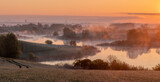 Fototapeta Kwiaty - Beautiful, misty sunrise over spring fields