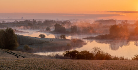 Wall Mural - beautiful, misty sunrise over spring fields