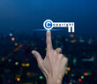Hand pressing copyright key icon over blur colorful night light modern city tower and skyscraper, Copyright and patents concept