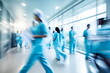 Medicals and doctors walk down a hospital corridor. Blurred motion	
