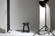 Studio Light Setup for Fashion Shoot. Beauty Dish Modifier on White Cyclorama with Polyboards and Stool. 