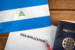 Visa application form, passport and flag of Nicaragua
