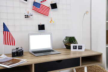 Wall Mural - Interior of light office with workplace, laptop and USA flags