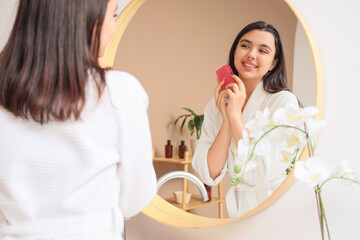 Sticker - Young woman with soap near mirror in bathroom