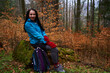 Woman hiker on a rainy day in the forest