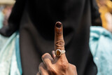 Fototapeta Góry - Voter shows inked finger after cast vote