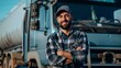 © liliyabatyrova - A man with a truck is smiling and wearing a plaid shirt