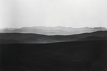 Wall Mural - A horizon line punctuated by the silhouettes of distant mountains.