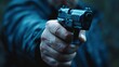 © mohammad - Close-up view of a man's hand holding a black gun with a slightly blurred background, Ai generated Images