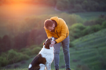 Sticker - Happy dog and man playing outdoor