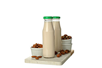 Wall Mural - PNG, Bottles of milk and nuts in bowls on board, isolated on white background