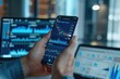 © ffunn - business, technology, internet and people concept - close up of man with laptop computer and smartphone with stock market chart on screen over office background