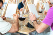 © Alfonso Soler - Painting workshop. Students painting with a glass of wine