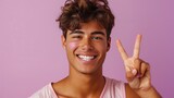 Fototapeta Do akwarium - Smiling young man with pink face paint making peace sign. LGBTQIA+