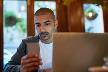 Poster - Laptop, phone and businessman in cafe working on creative web design for startup company. Technology, freelancer and male copywriting editor with computer and cellphone for online research project.