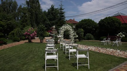 Wall Mural - a round arch for a wedding ceremony with decor and flowers