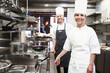 Restaurant, chef and portrait of people in kitchen for hospitality service, teamwork or career. Fine dining, cook and smile with collaboration in food industry for catering, job or culinary in France