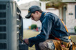 A technician in work clothes is repairing the outdoor cabinet of a home air conditioner