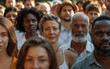 © imagineRbc - A crowd of people are standing together, with some of them wearing hats. Scene is lively and social, as the people are gathered together in a public space
