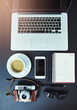 Startup business, photographer and desk with laptop from above, freelance and research in home office. Smartphone, coffee and notebook on table in study for marketing, scheduling or editing in house