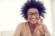 Smile, home and portrait of black woman, relax and happiness with weekend break, afro and chilling. African person, apartment or girl with glasses, cheerful and clear vision with sunshine or carefree