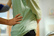 Closeup shot of examining senior man's back. Rehabilitation and Healthcare concept