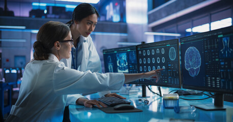 Poster - Medical Hospital Research Laboratory: Caucasian And Asian Female Scientists Talking And Using Desktop Computer With MRI Scans Of Human Brain. Surgeon And Neurologist Discussing Brain Damage Treatment.