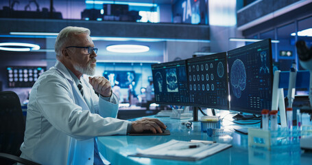 Aufkleber - Senior Male Neuroscientist Using Desktop Computer To Analyze MRI Scans Of Brain In Medical Research Center Laboratory. Caucasian Surgeon Studying CT Scan Of Patient Suffering From Brain Tumor.
