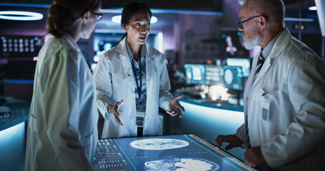Poster - Modern Hospital Medical Research Center: Diverse Colleagues Gathered Around Interactive Touch Screen Table With MRI Scans Of Brain On Display. Doctors Discussing Rehabilitation Solutions After Stroke.