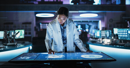 Aufkleber - Female Asian Neuroscinetist Using Interactive Touch Screen Table With MRI Scans On Display In Modern Biotechnology Research Center. Doctor Developing Innovative Devices For People With Alzheimer's.