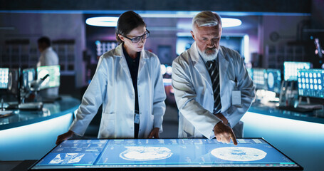 Aufkleber - Modern Hospital Medical Cancer Research Center: Caucasian Female Neuroscientist And Male Surgeon Talking, Using Interactive Touch Screen Table With CT Scan Of Human Brain With Tumor, Finding Treatment