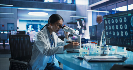 Poster - Medicine Development Laboratory: Asian Female Scientist Using Microscope, Analyzes Petri Dish Sample. Big Pharmaceutical Lab with Specialists Conducting Biotechnology Research, Developing New Drugs.