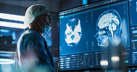 Aufkleber - Medical Hospital Research Laboratory: Caucasian Male Neurosurgeon Looking At TV Screen With Brain MRI Scans Of Patient, Analyzing, Preparing For Complicated Neurosurgery, Wearing Surgical Gown.