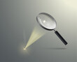 A realistic magnifying glass burns a surface using a sunbeam. Vector illustration.