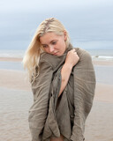 Fototapeta  - Young nude woman posing on the seaside