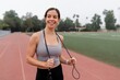 © Rawpixel.com - Woman in sports tank top holding skipping rope