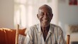 portrait of a dark-skinned smiling pensioner over 60 years old looking at the camera looking at the camera