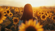 back view of woman in sunflower field during sunset, travel and vacations concept