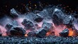   A tight shot of flaming rocks atop a black backdrop Fire emerges from their summits