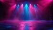© Awais - A purple spotlight shines on an empty stage with a circular platform.
