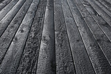 Fototapeta Natura - Burnt wooden board texture. Sho Sugi Ban Yakisugi is a traditional Japanese method of wood preservation