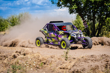 Wall Mural - UTV vehicle offroad kicking up sand on dune. Extreme, adrenalin. 4x4.