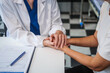 © NanSan - Monthly health check-ups and counseling sessions are provided to an elderly Asian woman by a Caucasian female caregiver, offering support, advice, and motivation.