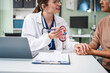 © NanSan - Caucasian woman and elderly Asian woman discuss kidney model issues like gallstones, glomerulonephritis, acute/chronic kidney disease, infections, abnormal ureters, cysts, urinary system cancer.