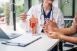 © NanSan - Caucasian woman and elderly Asian woman discuss health issues cold, influenza, pneumonia, bronchitis, stomach disease, GERD, IBS, inflammatory bowel disease, gallstones, chronic constipation