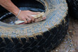 selective focus Used car tires are being cleaned by employees at a used tire shop. Makes the tires look newer
