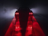 Fototapeta Londyn - Car with red lights driving on a road, AI-generated.