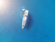 Aerial top view by drone of luxury yacht in the sea.